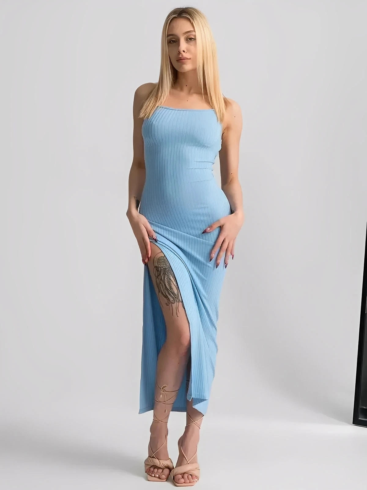 Sky Lace Midi Dress in soft blue with ribbed bodycon fit and high side slit, showcasing an open corset back.