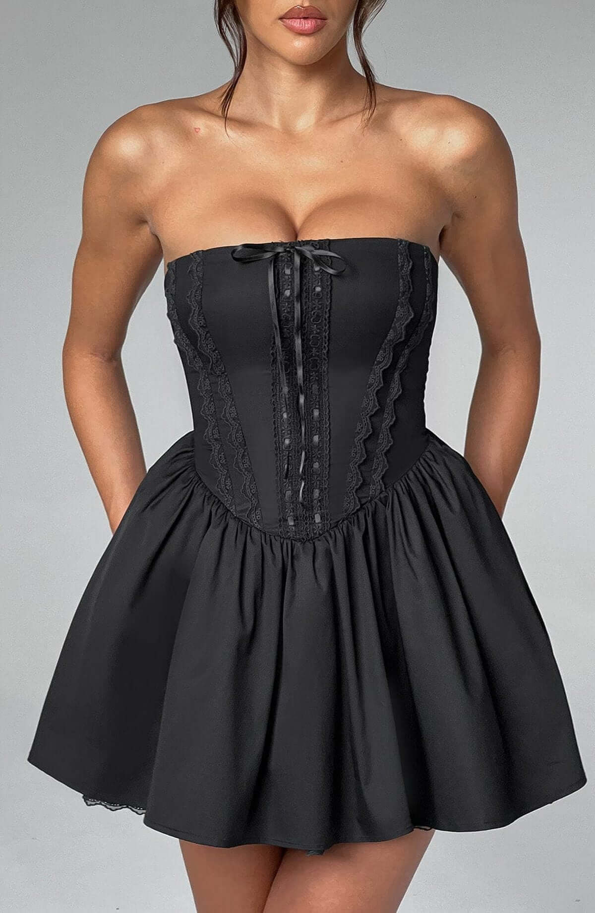 Elegant black corset mini dress with strapless neckline, perfect for parties and evening events.