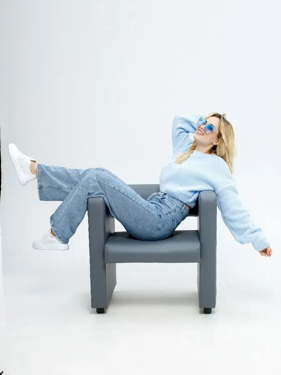 Skylar Pullover worn by a model in sky blue, paired with denim, showcasing a stylish and relaxed look.