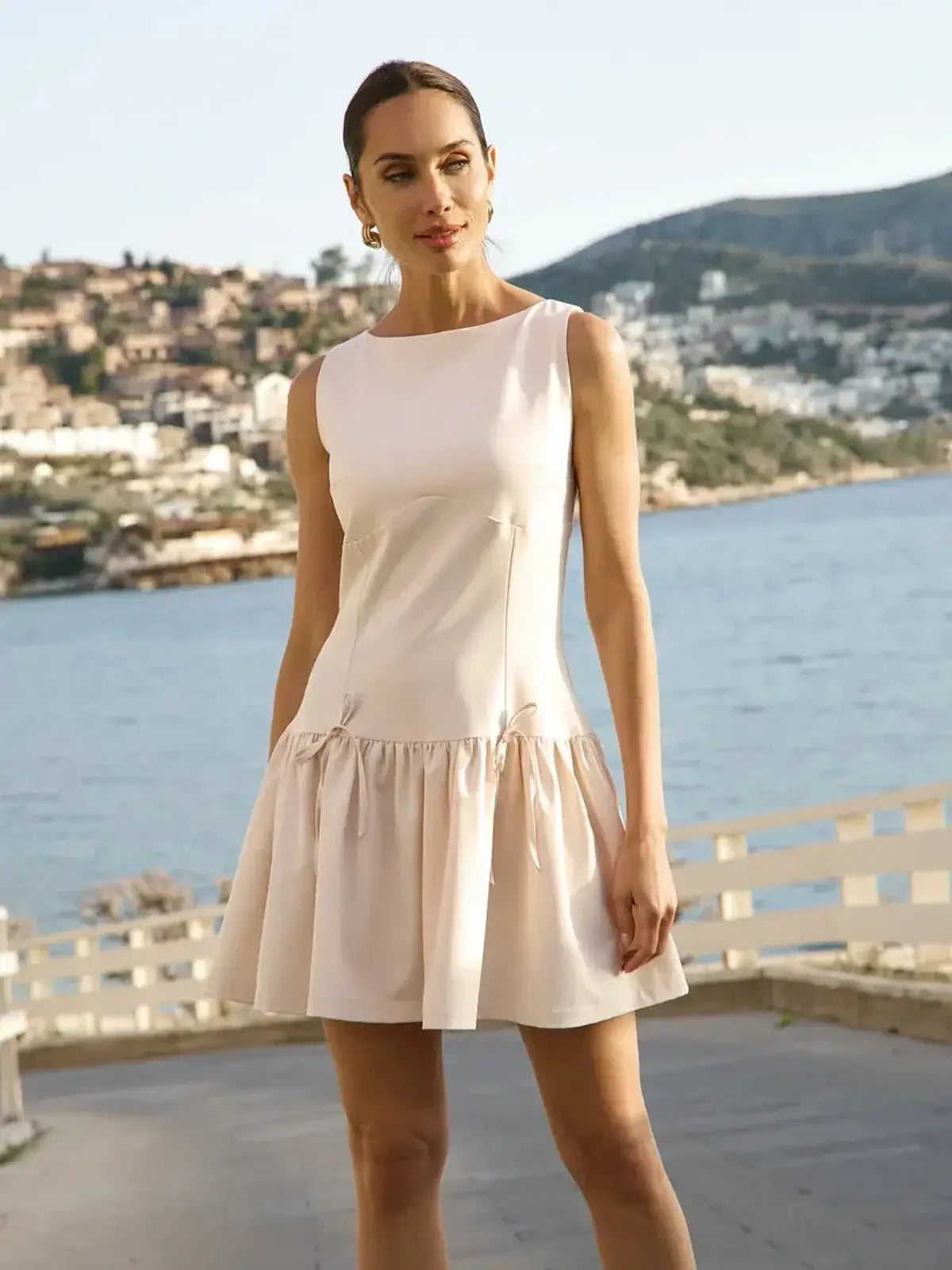 Elegant white mini dress with flared skirt, perfect for summer, weddings, and special occasions.