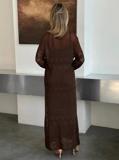 Back view of a woman wearing the Solara Maxi Dress by Lauven, showcasing its warm dark brown crochet knit design.