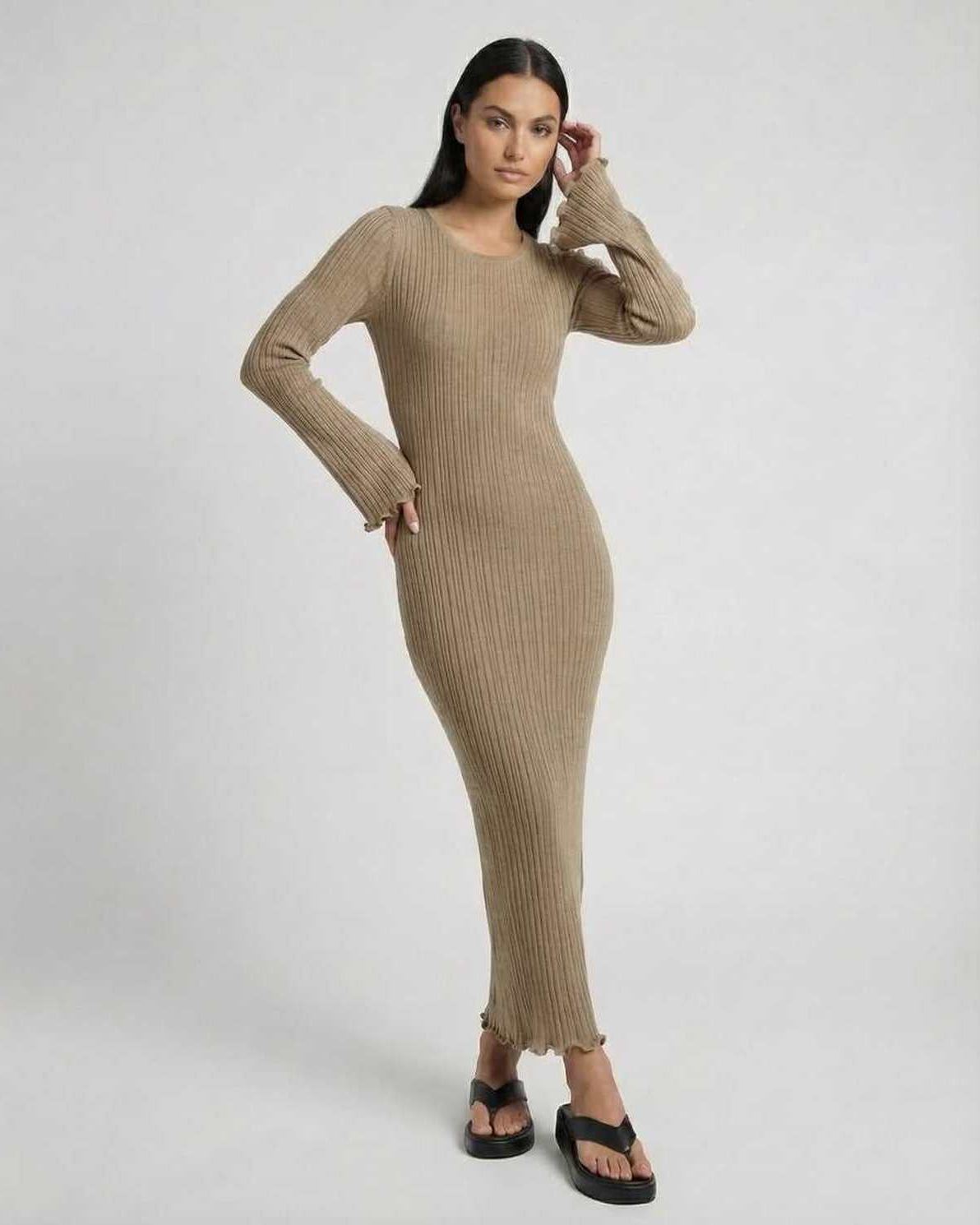 Lauven Solara Maxi Dress in warm taupe, featuring ribbed knit, long flared sleeves and delicate ruffle details.