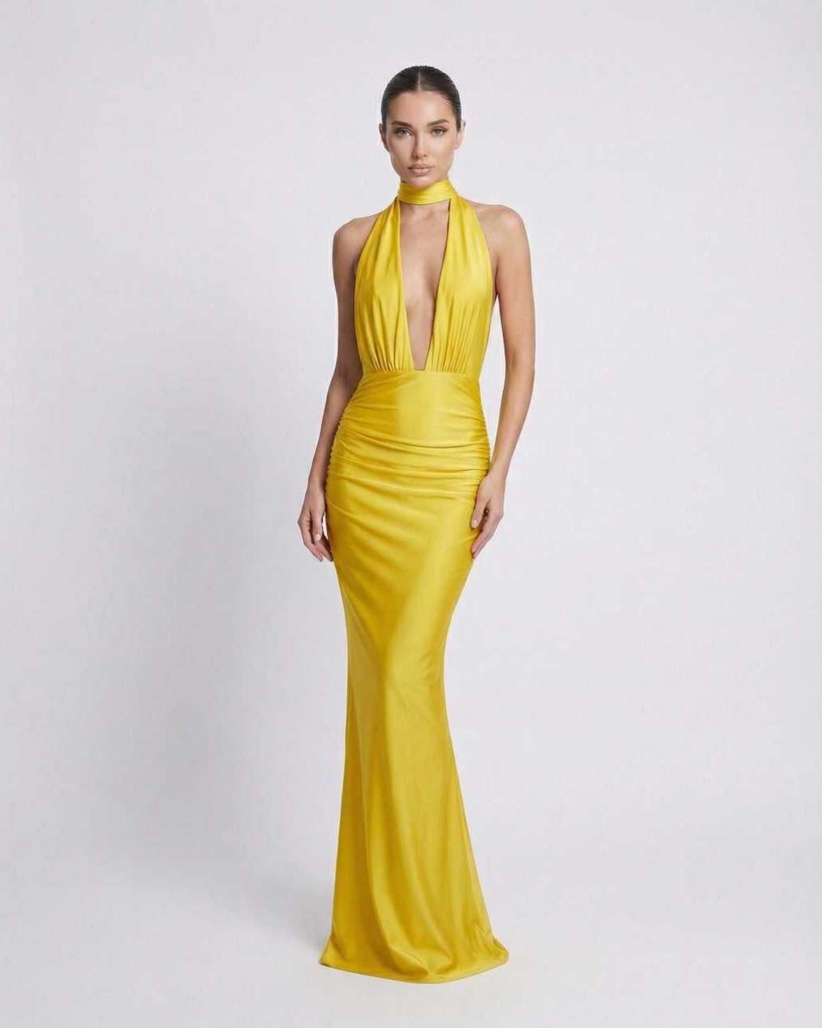 Solara Maxi Dress: Yellow halter design with deep plunge, high waist, sleek fabric, perfect for special occasions by Lauven.