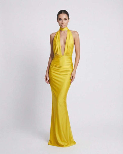 Solara Maxi Dress: Yellow halter design with deep plunge, high waist, sleek fabric, perfect for special occasions by Lauven.