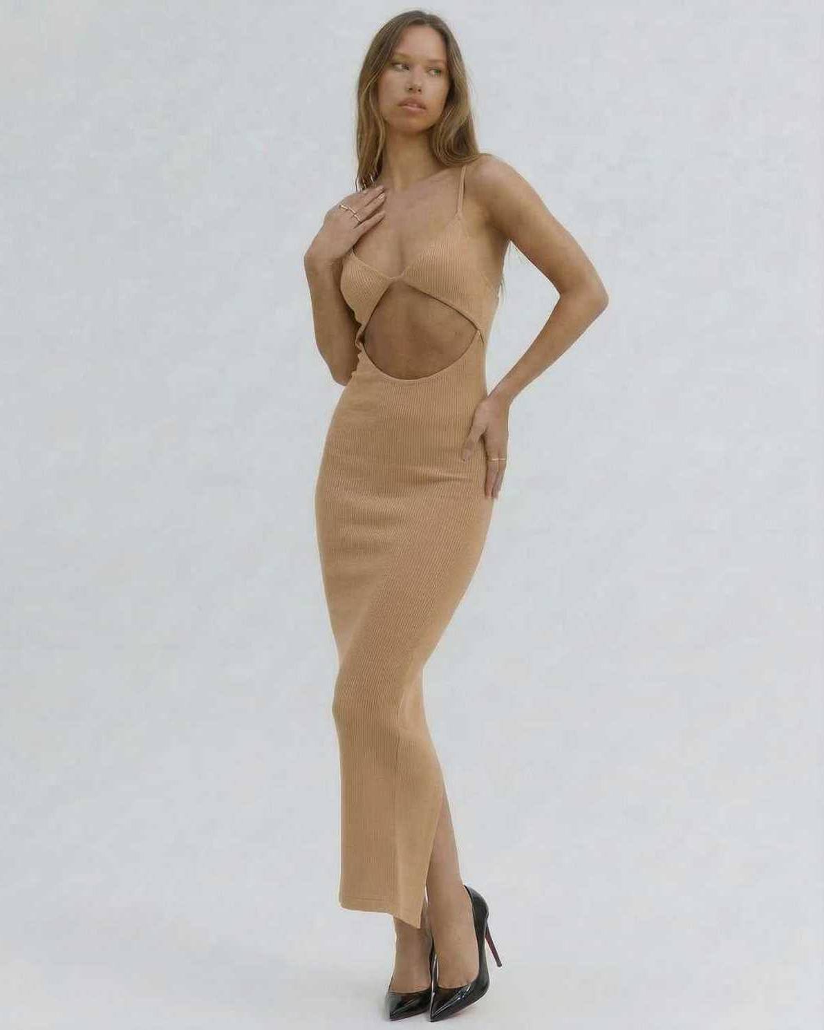 Solara Midi Dress by Lauven - Elegant cut-out spaghetti strap dress in nude on model, showcasing flattering slim fit.