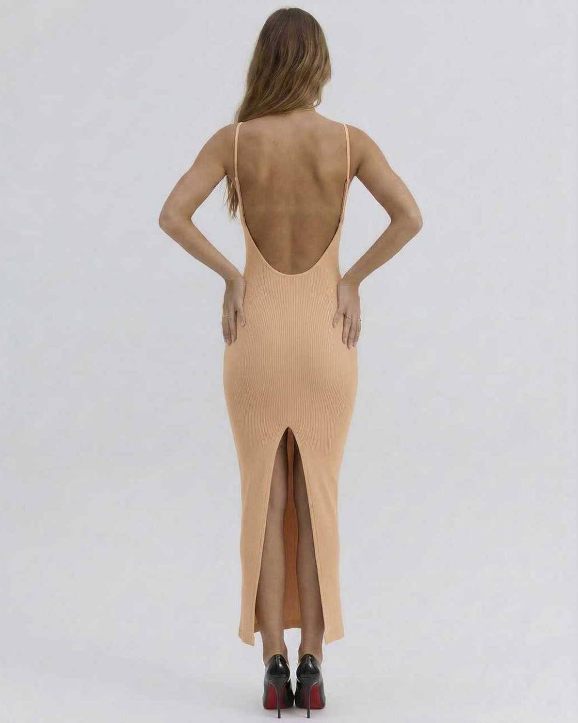 Back view of Solara Midi Dress by Lauven, featuring a deep cut and stylish slit for an elegant look.