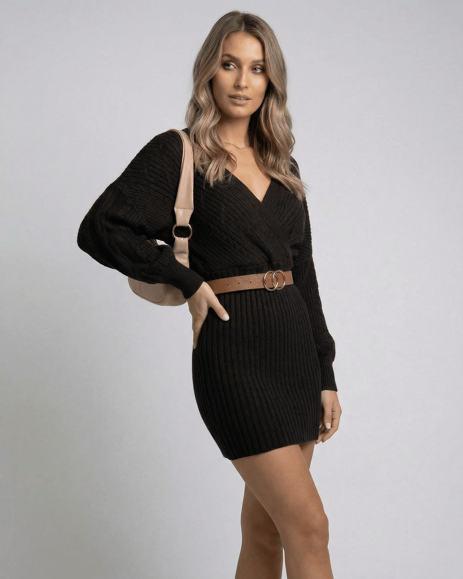 Solara Mini Dress by Lauven, chic black high waist bodycon knit dress with deep V-neckline and long sleeves.