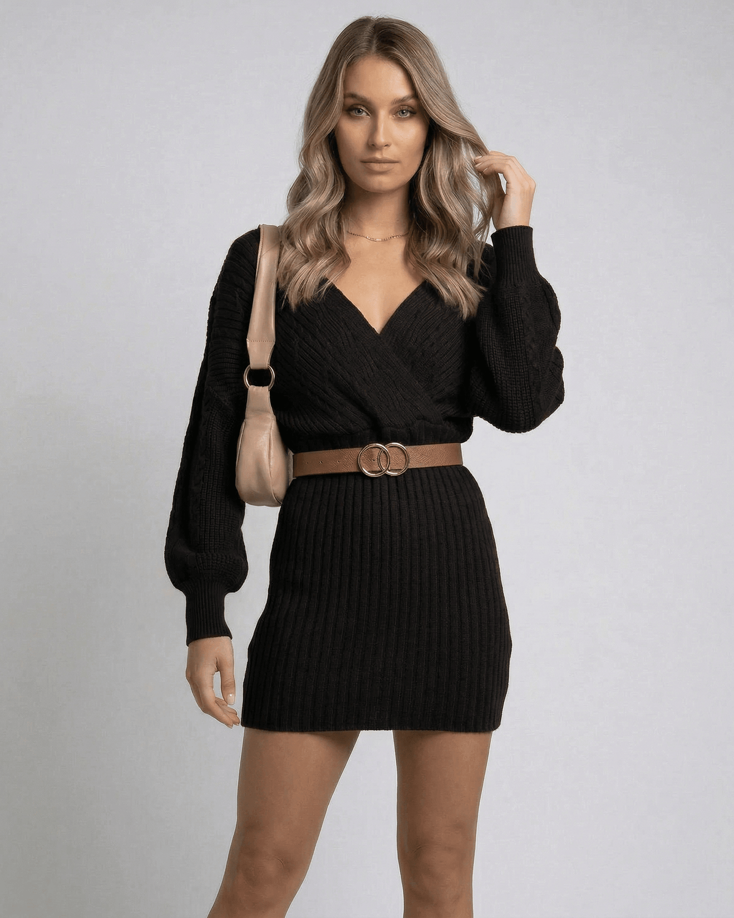 Solara Mini Dress by Lauven, chic black bodycon knit dress with deep V-neck and cuffed sleeves.