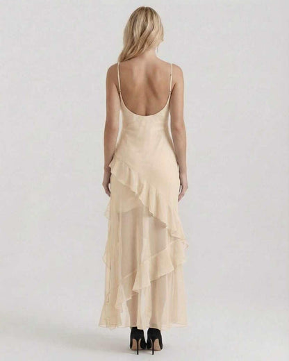 Soleil Maxi Dress showcasing sheer ruffle hem and lightweight fabric, offering elegance and movement by Lauven.