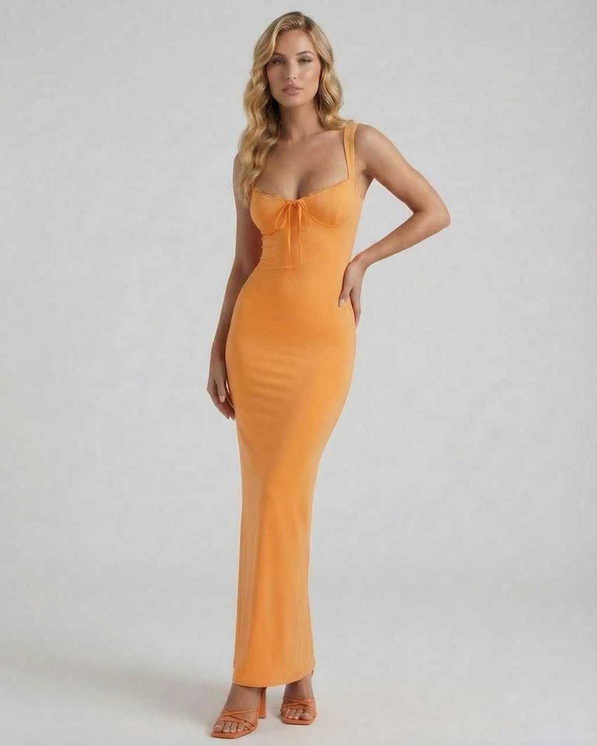 Soleil Maxi Dress by Lauven in vibrant orange, featuring spaghetti straps and a sexy fitted silhouette.