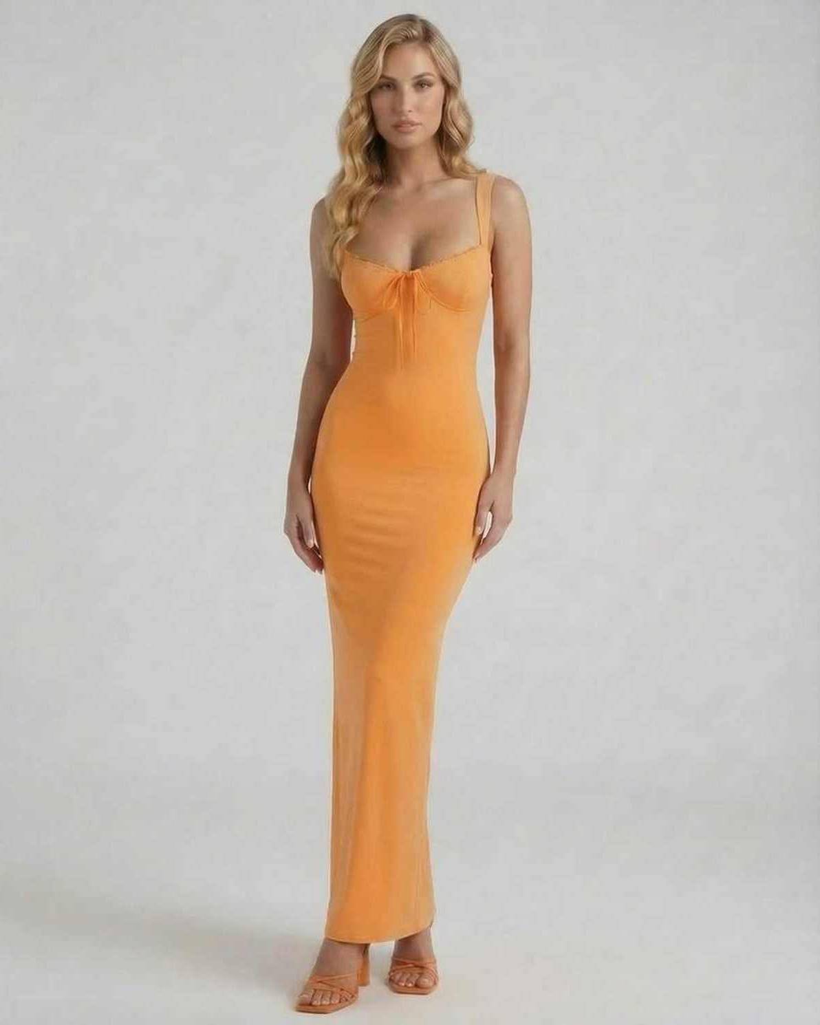 Soleil Maxi Dress by Lauven in vibrant orange stretch knit, featuring spaghetti straps and a sexy silhouette.