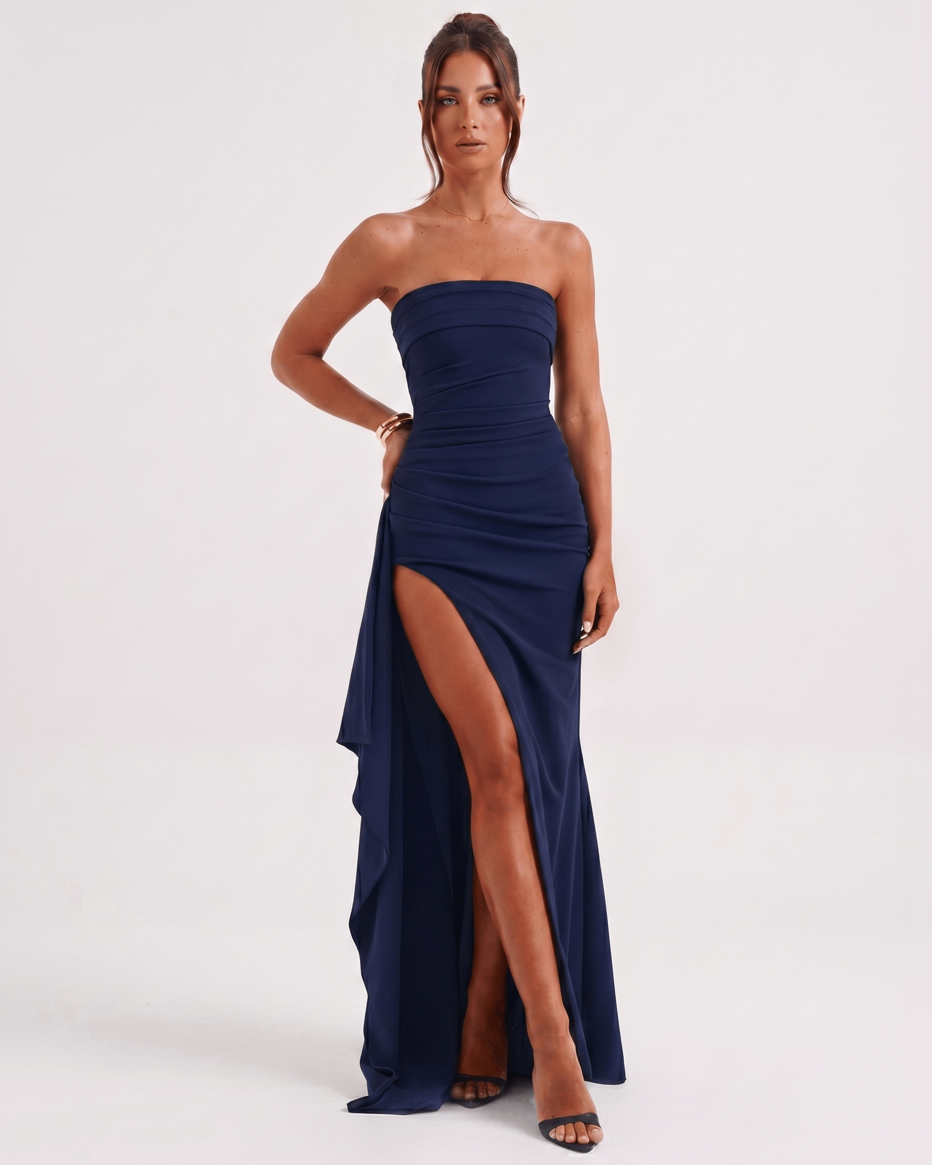 Solenne Maxi Dress in navy with bandeau style, high waist, side slit, and asymmetrical panel for a modern look by Lauven.