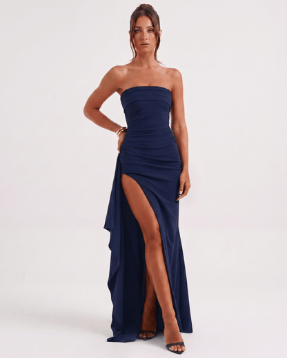 Solenne Maxi Dress in navy with bandeau style, high waist, side slit, and asymmetrical panel for a modern look by Lauven.