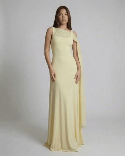 Solenne Maxi Dress by Lauven - Light yellow slip dress with square neck and mesh shawl detail, showcasing a modern, streamlined silhouette.