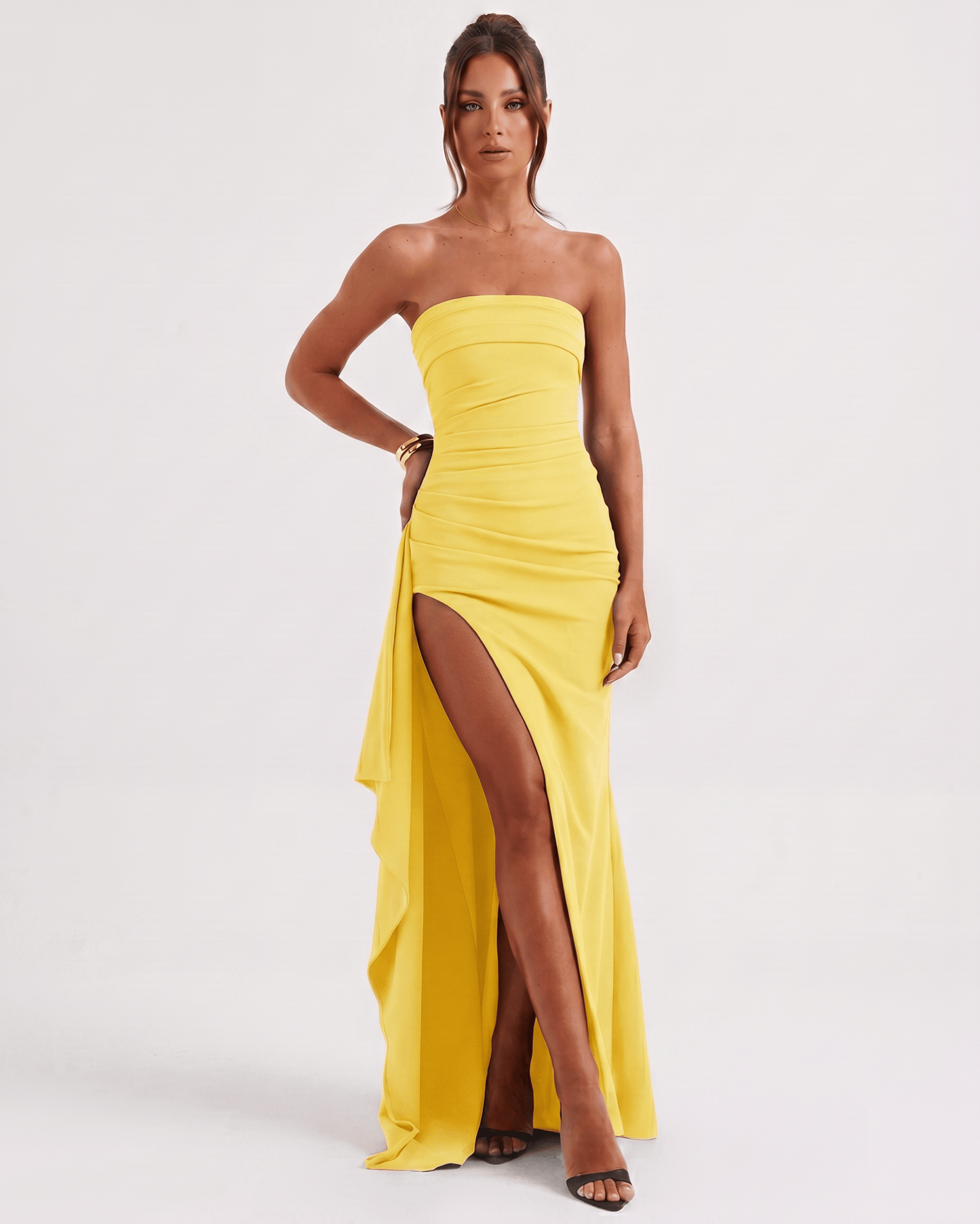 Solenne Maxi Dress by Lauven in yellow, featuring a bandeau design, side slit, and asymmetric panel for a modern look.