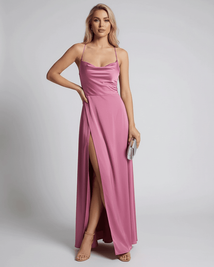 Lauven Sorrento Maxi Dress in pink, featuring a satin slip design and high slit for an elegant evening look.