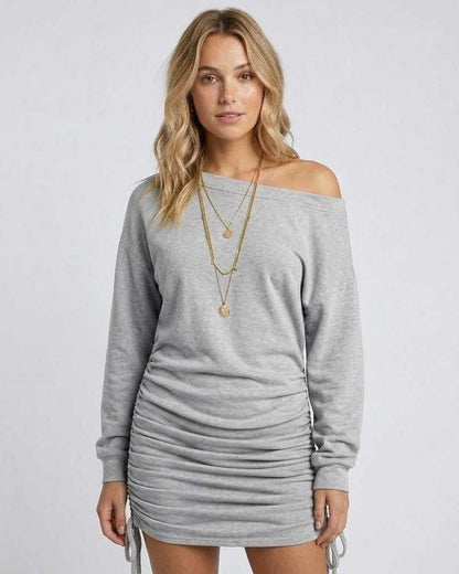 Model wearing the Sterling Mini Dress by Lauven, featuring adjustable side gathered drawstrings in light gray.