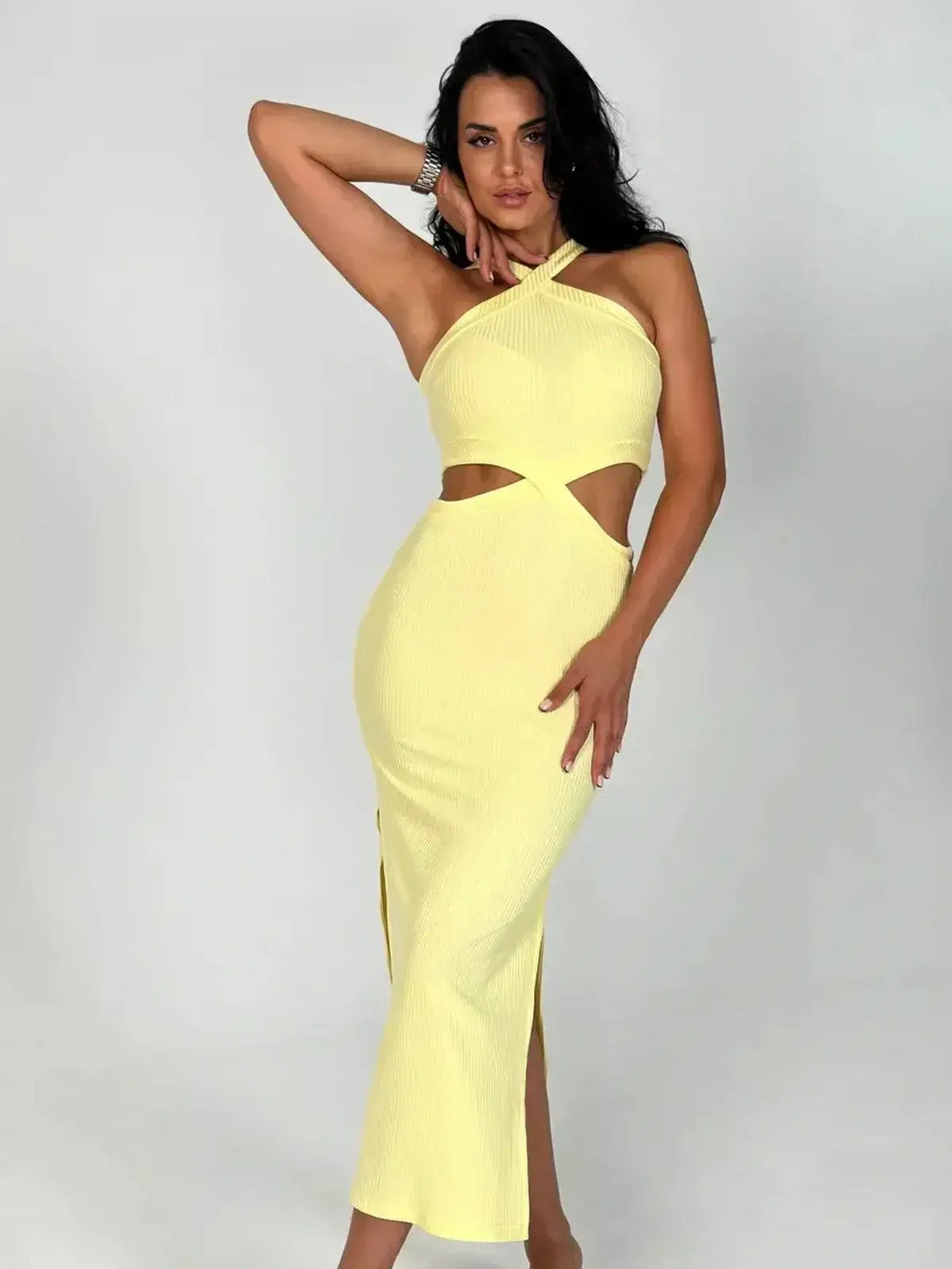 Sunlace Midi Dress in pastel yellow featuring sculptural cutouts and a flattering fit, ideal for warm-weather events.