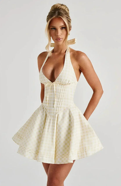 Halter neck yellow gingham mini dress for women, perfect for summer parties or weddings.