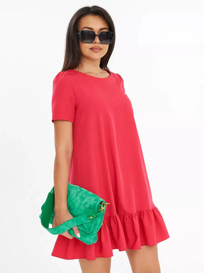 Vibrant coral red mini dress with ruffled hem, styled with green handbag and sunglasses, perfect for summer occasions.