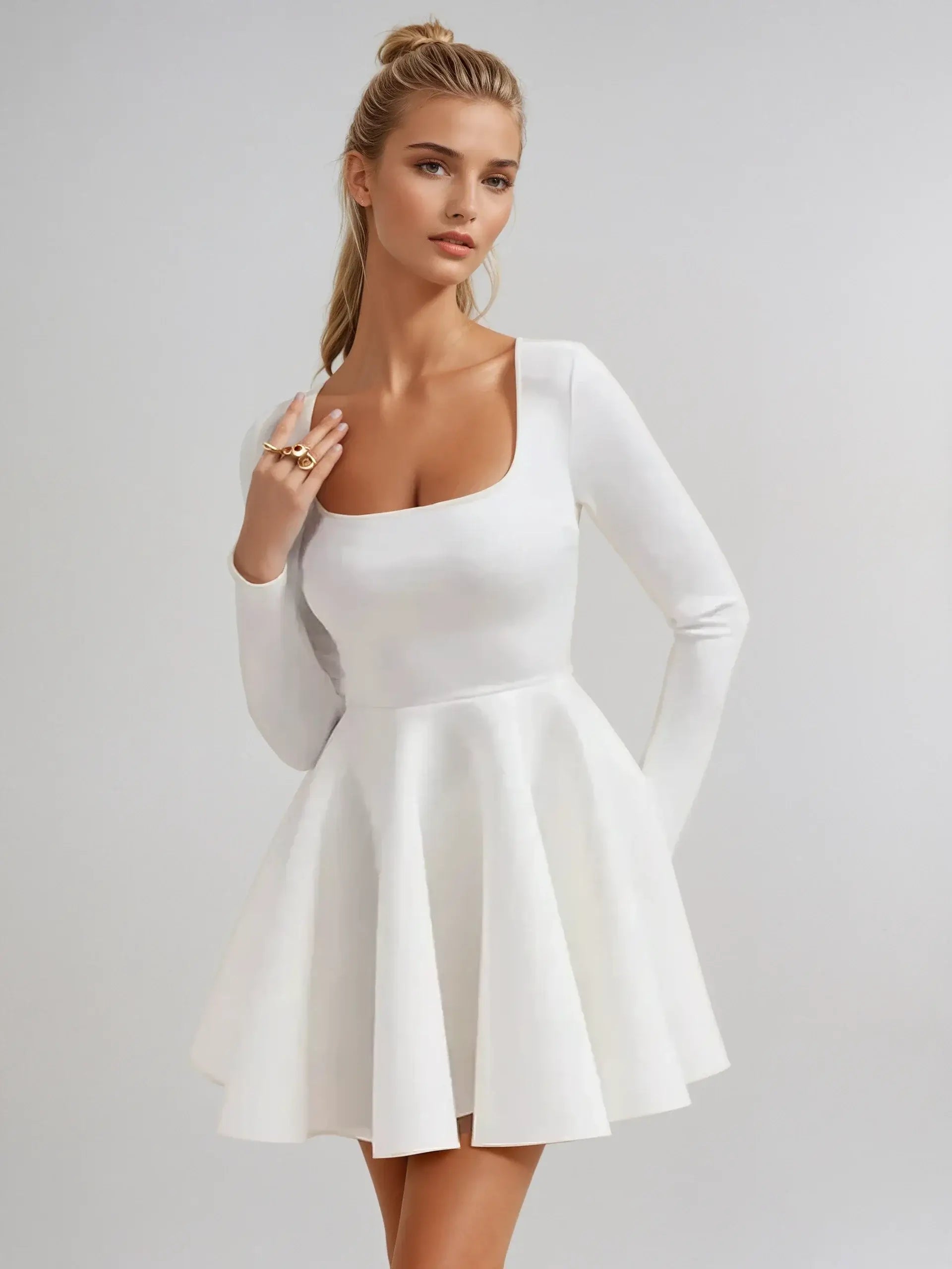 Elegant white fit-and-flare mini dress with long sleeves and square neckline, perfect for weddings or summer events.