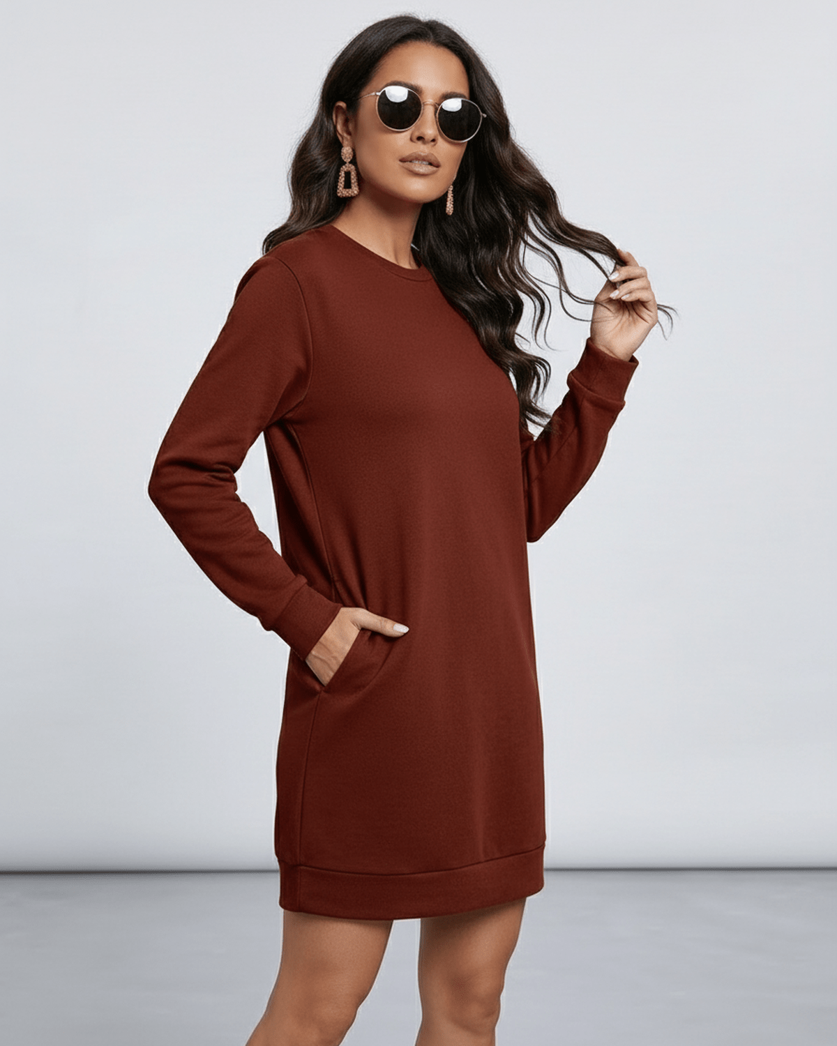 Model wearing Lauven Terra Mini Dress in rich brown, showcasing casual style with O neckline and long sleeves.