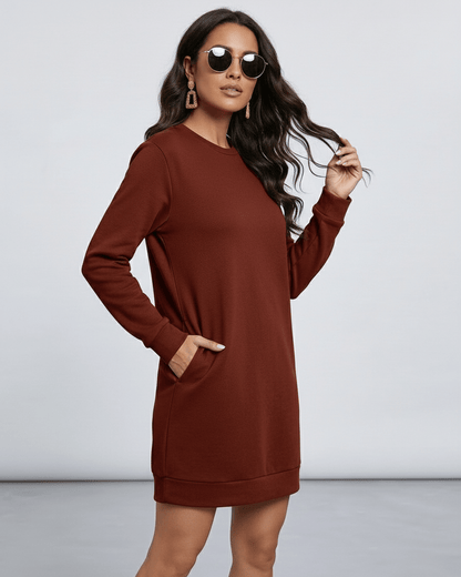 Model wearing Lauven Terra Mini Dress in rich brown, showcasing casual style with O neckline and long sleeves.