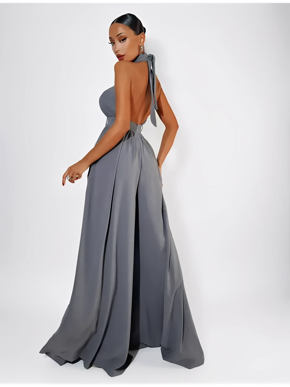 Chic open-back Twist Halter Jumpsuit in grey, featuring a wide-leg silhouette and elegant twist-front neckline.