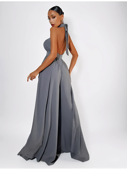 Chic open-back Twist Halter Jumpsuit in grey, featuring a wide-leg silhouette and elegant twist-front neckline.