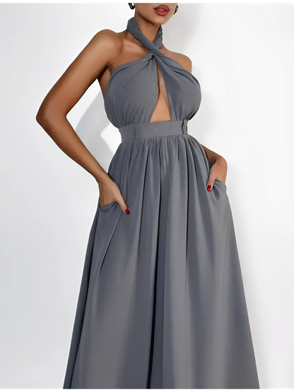 Twist Halter Jumpsuit in grey with open back and wide leg design, showcasing elegant summer fashion.