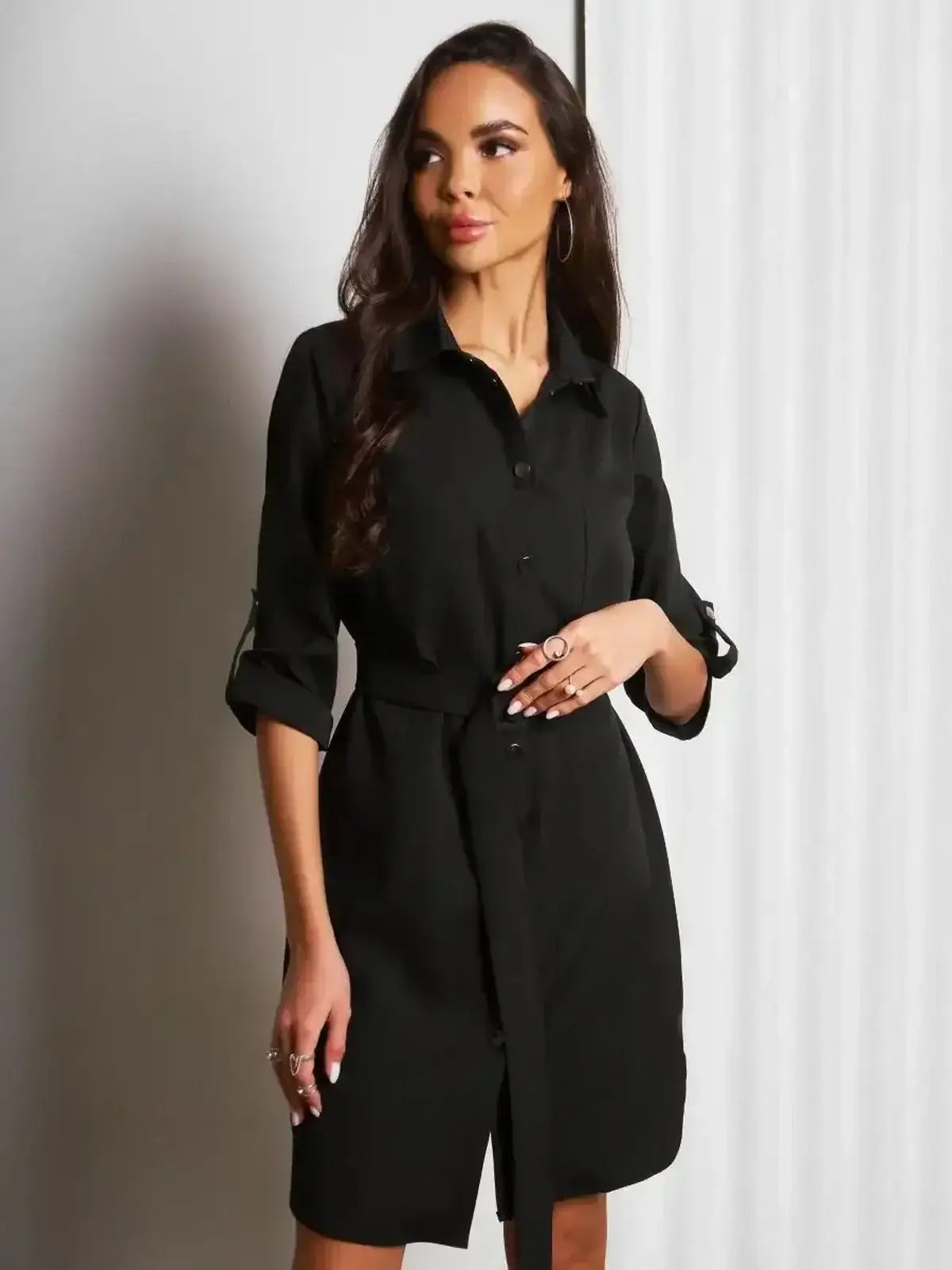 Urban Edit Mini black dress by Lauven, featuring a structured silhouette and detachable belt for a chic look.