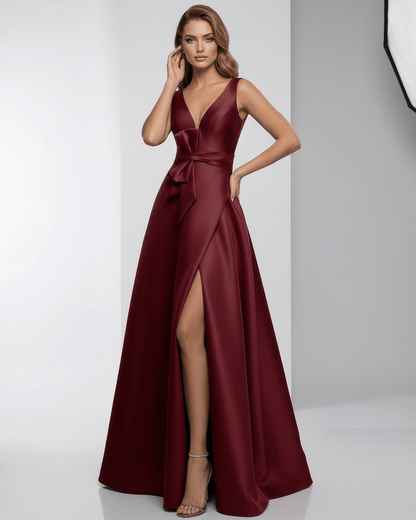 Valencia Maxi Dress in burgundy satin, featuring a V-neckline, A-line silhouette, and elegant flow from Lauven.