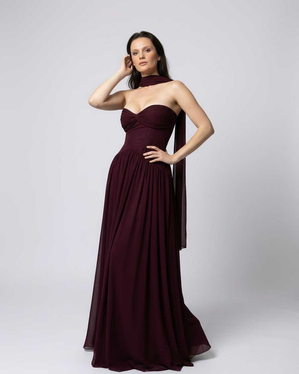 Valencia Maxi Dress featuring a burgundy strapless design and elegant flowing silhouette by Lauven.