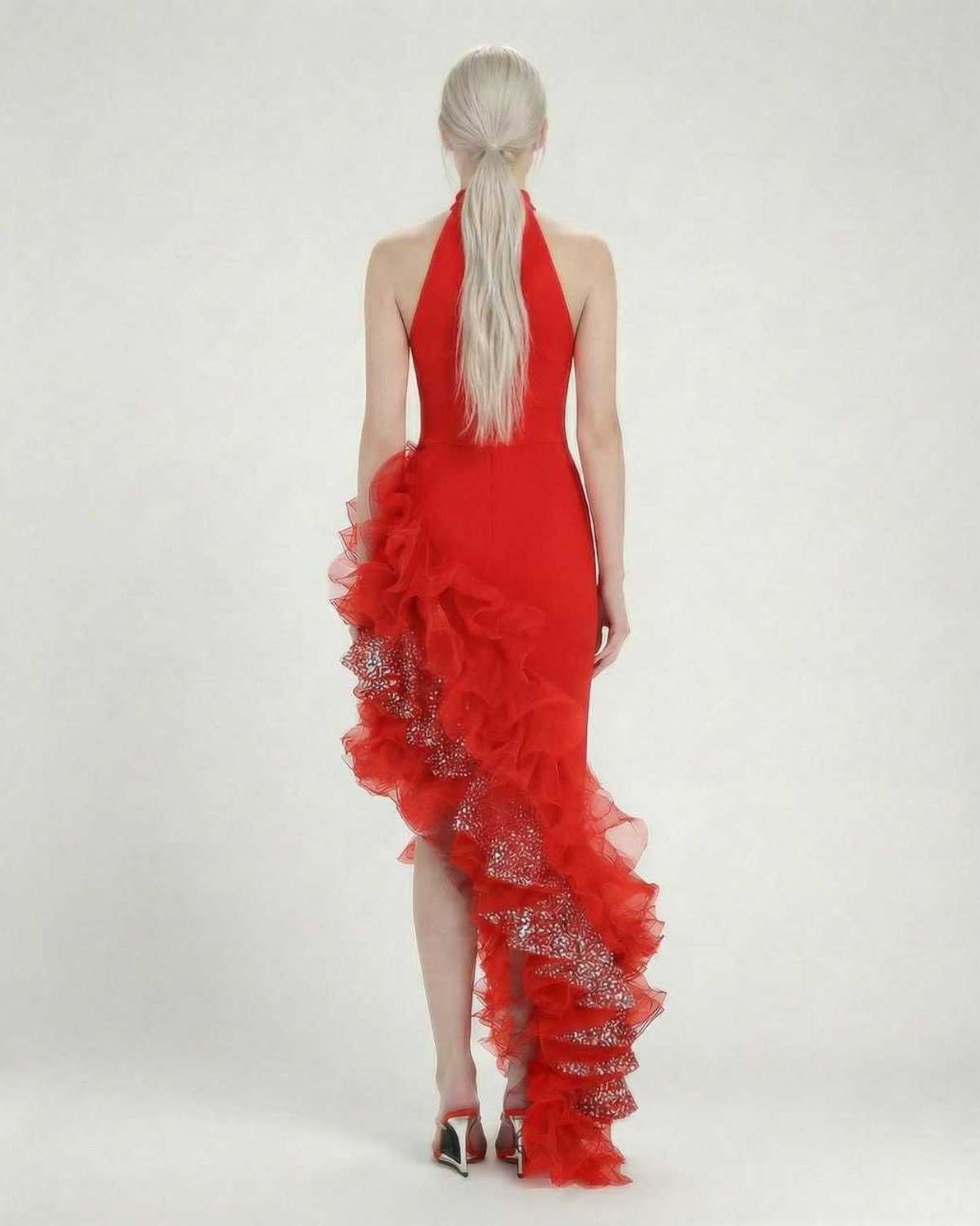 Valencia Maxi Dress by Lauven – Back view showcasing the red halter neck and asymmetrical ruffle detail.