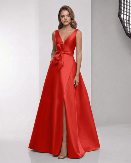 Valencia Maxi Dress - Red satin A-line dress with wrap slit, bow waist, and elegant V-neckline by Lauven.