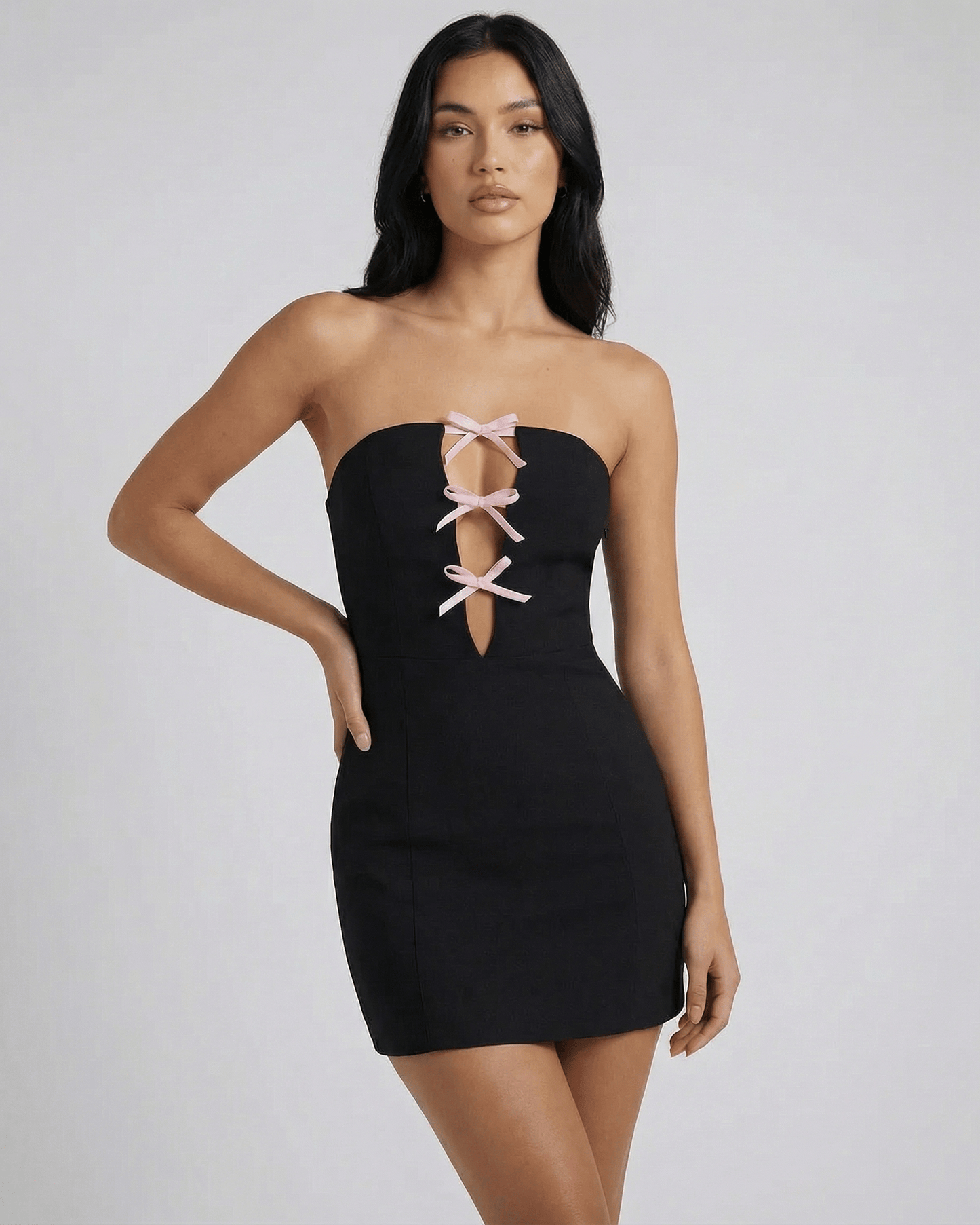 Valencia Mini Dress by Lauven featuring a strapless neckline and bow detail, showcasing a sleek bodycon silhouette.