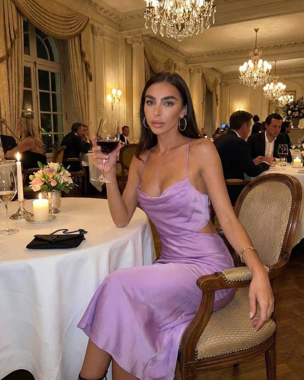 Vega Midi Dress in elegant lilac, sleeveless design worn at a dinner event, showcasing luxury and sophistication.