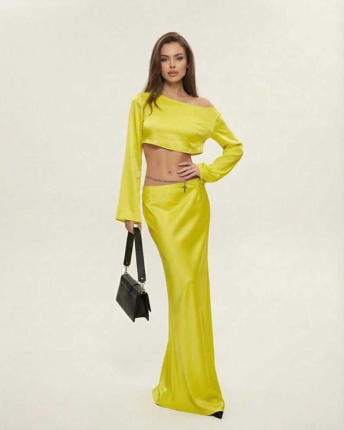 Vega Midi Dress by Lauven in vibrant yellow, showcasing an elegant asymmetrical silhouette.