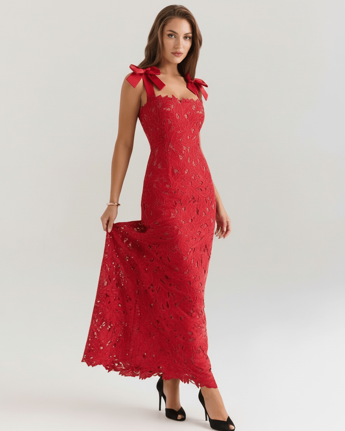 Model wearing Velmira Maxi Dress, a red lace maxi dress with square neckline and shoulder ties, perfect for formal occasions.