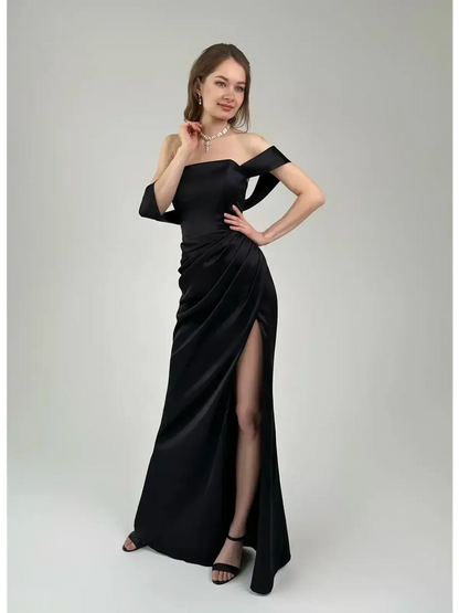 Elegant off-shoulder Velour Nights Maxi Dress featuring draping and high slit, perfect for evening events.