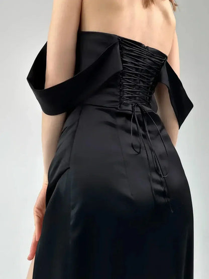 Back view of the Velour Nights Maxi Dress, featuring corset-style lacing and elegant off-shoulder design.