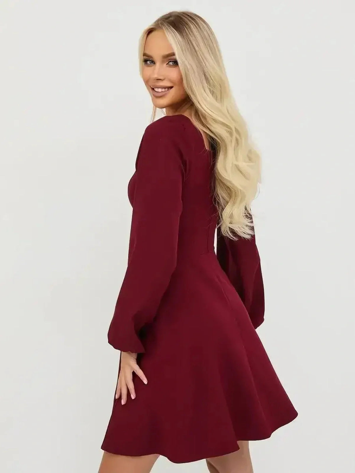 Long sleeve deep burgundy mini dress, perfect for parties and elegant occasions.