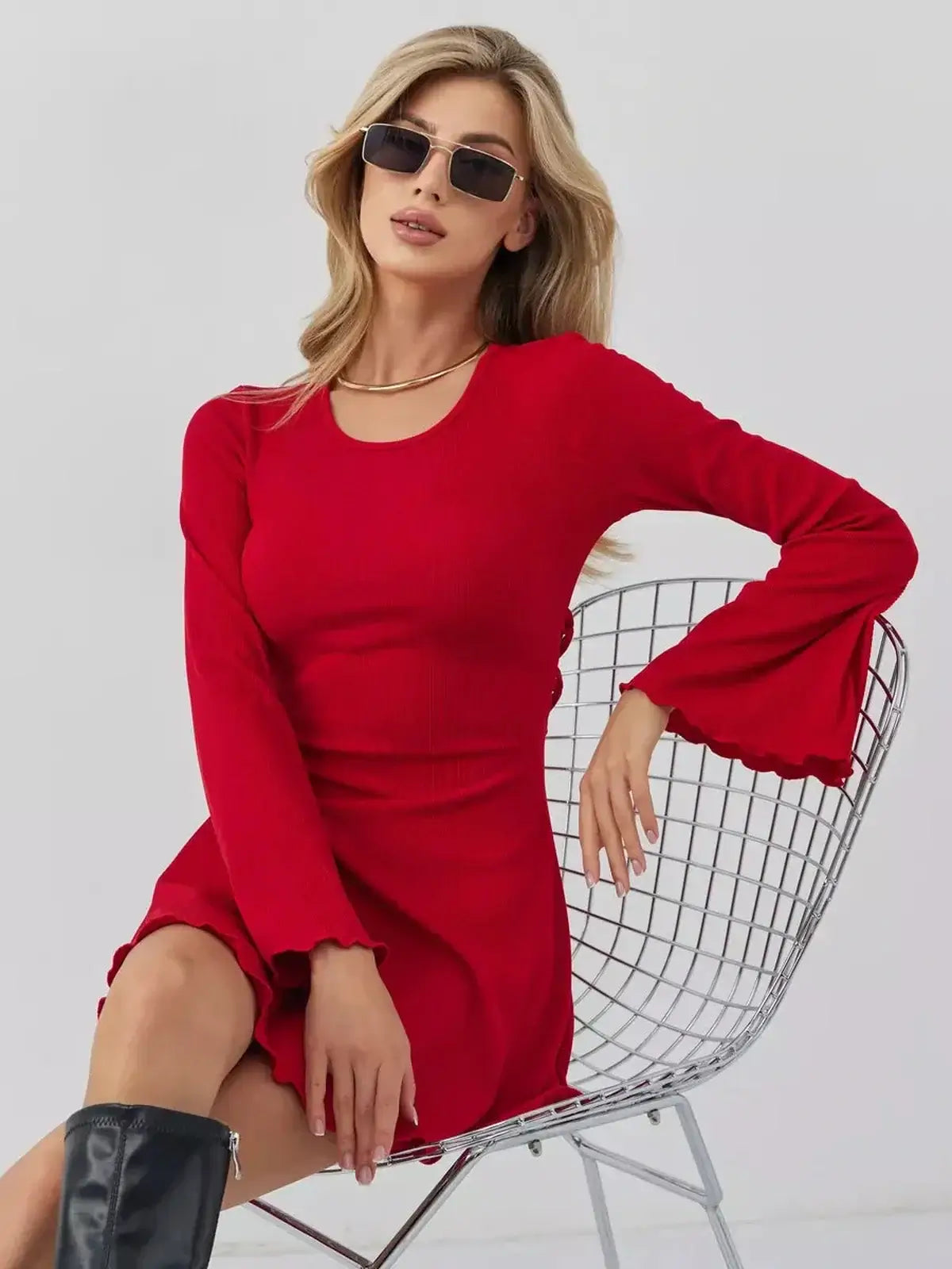 Model wearing Velvet Flame red mini dress by Lauven, featuring a U-neckline and flared sleeves, perfect for any occasion.