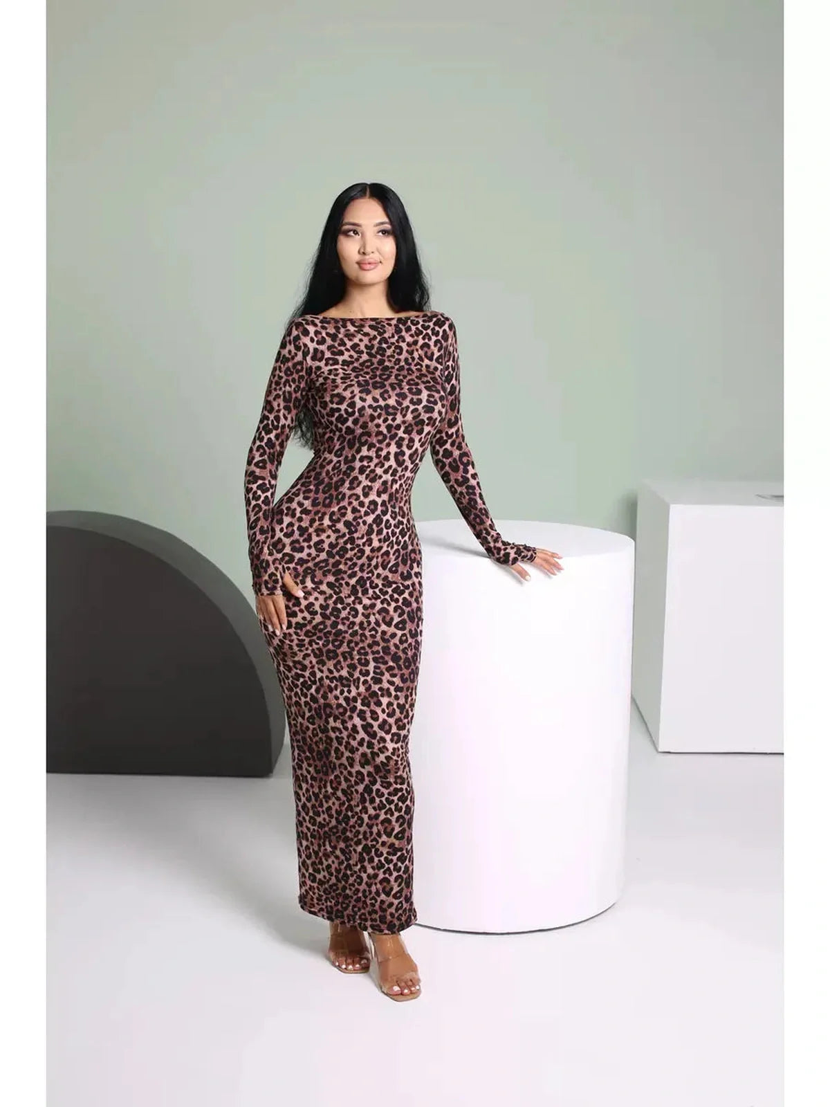 Velvet Wild Maxi Dress in leopard print, showcasing a sleek silhouette and elegant long sleeves on a model.
