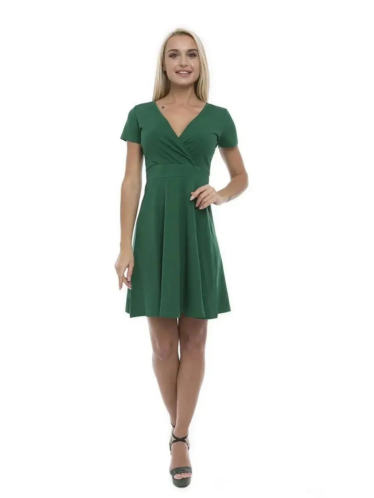 Model wearing the Verde Charm Mini dress in green, showcasing its flattering V-neckline and stylish silhouette.