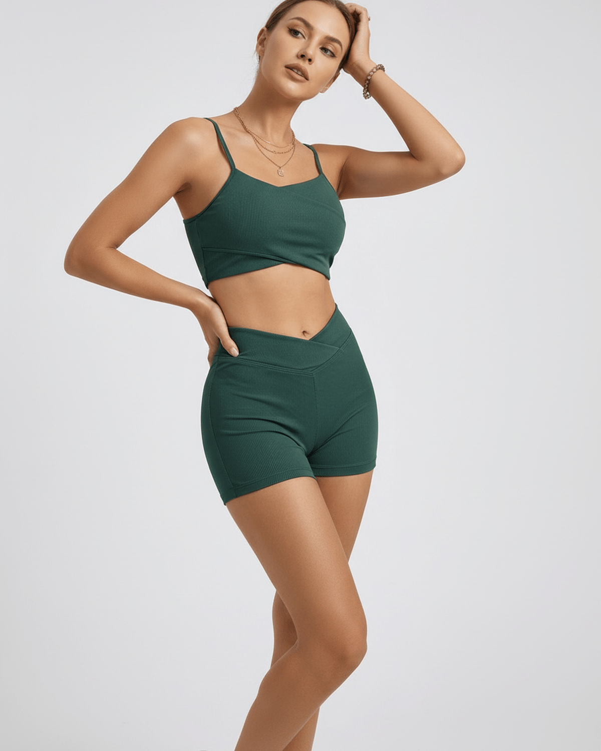 Lauven Verdea Two-Piece Swimsuit in green, breathable polyester, featuring sleek sleeveless top and sport shorts.