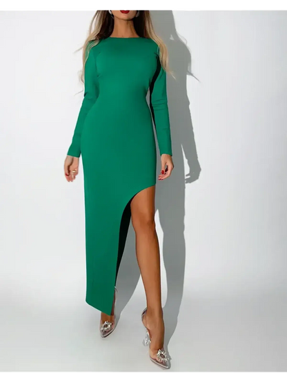 Verona Maxi Dress in emerald green, featuring a striking asymmetric hem and long fitted sleeves for sophisticated elegance.