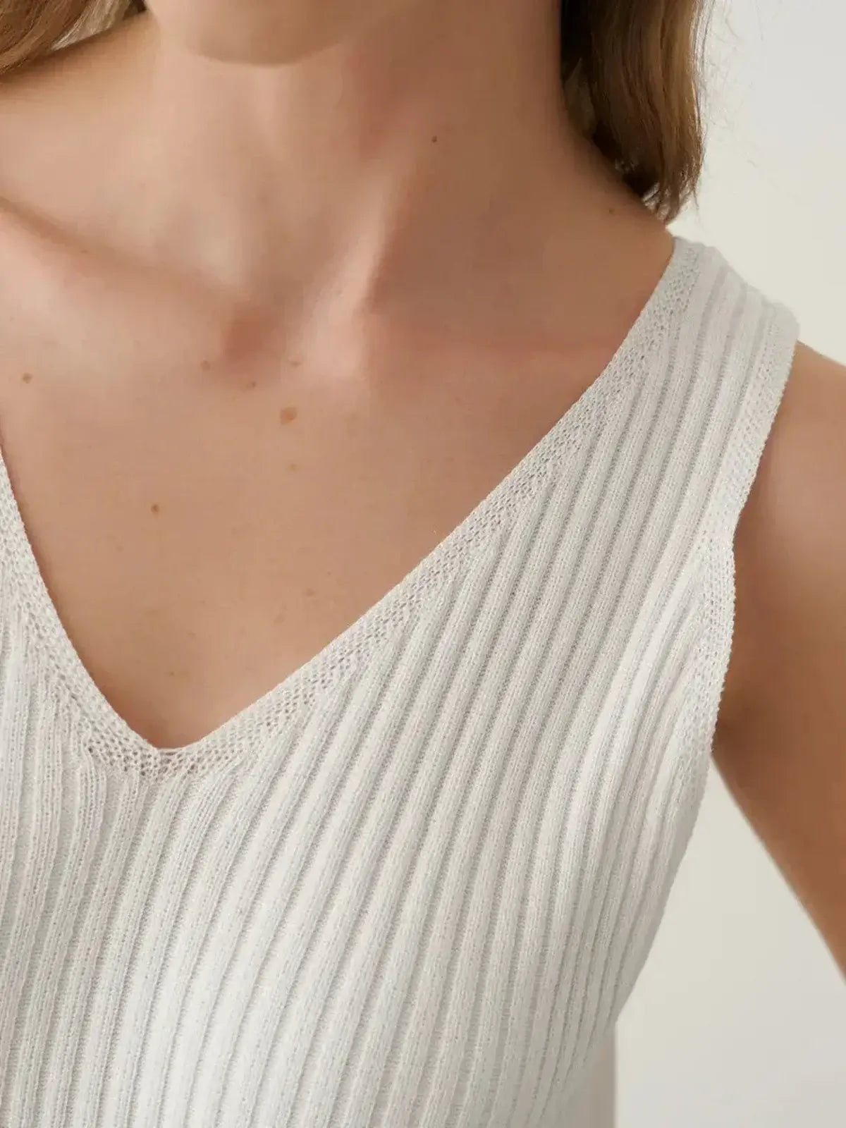 Close-up of the Verona Maxi Dress showcasing its elegant ribbed cotton-acrylic knit and soft v-neck design.