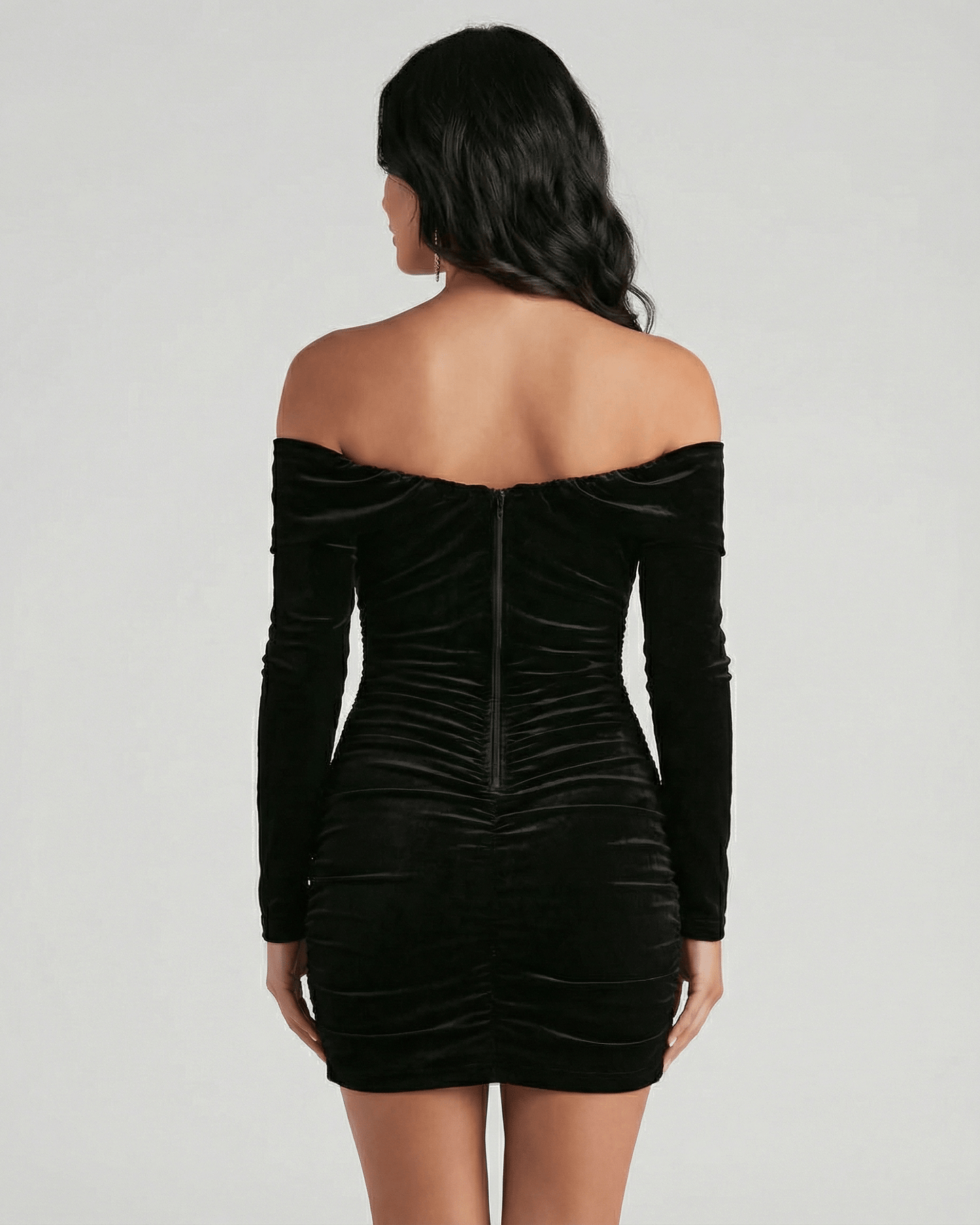 Verona Mini Dress by Lauven - Back view of black velvet off shoulder mini dress with long sleeves.