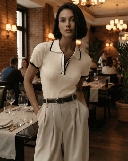 Verona Polo Shirt by Lauven featuring a slim silhouette and timeless contrast accents, showcased in an elegant dining setting.